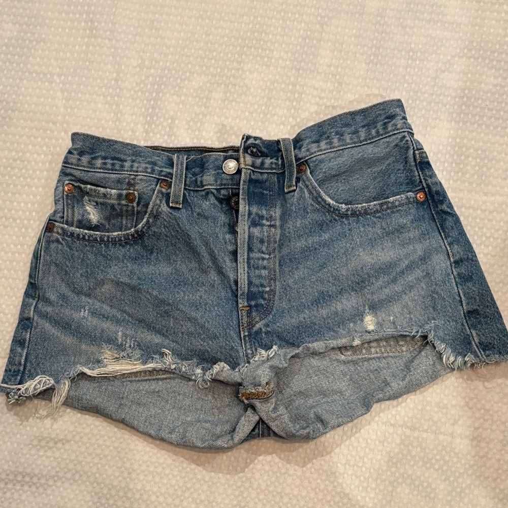 Levi’s 501 . Trendy Blue Distressed Denim Shorts